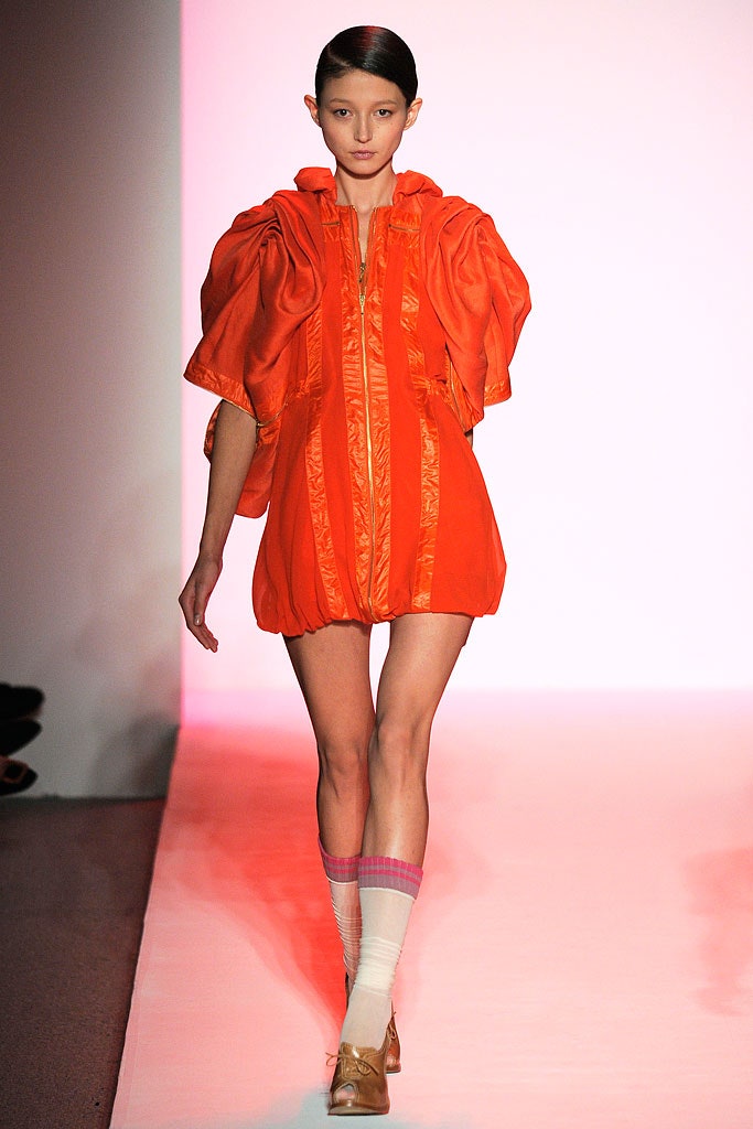 orange silk fitted jacket and shorts