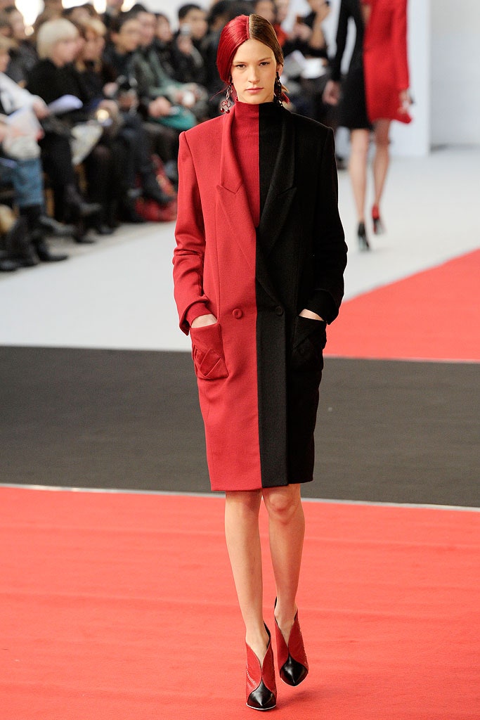 black wool long-sleeve collared tailored buttoned pockets coat