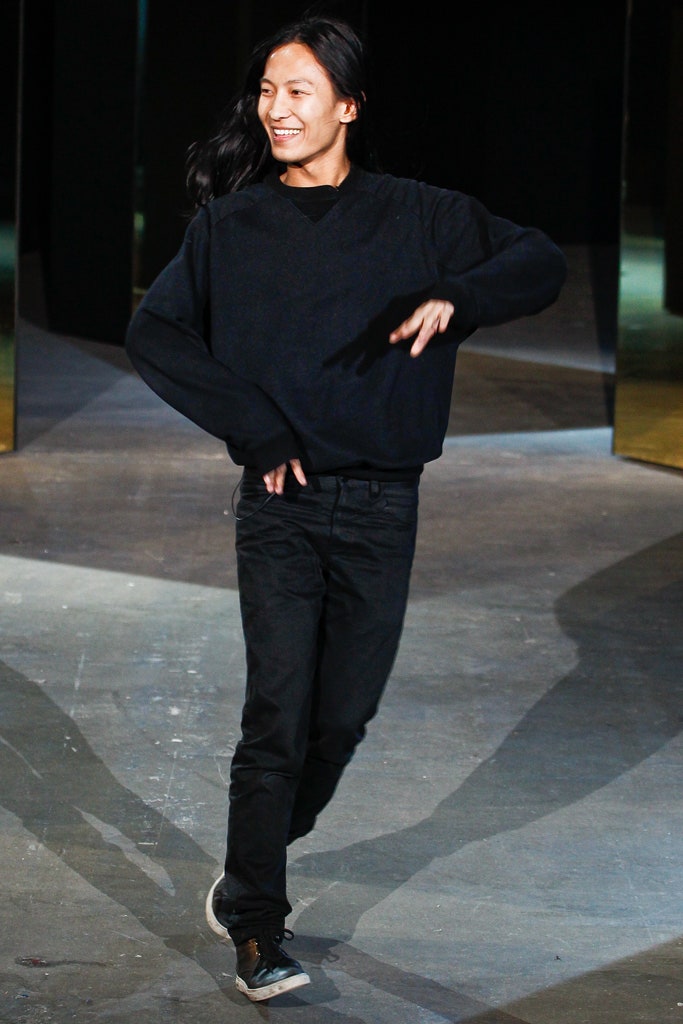 black relaxed sweater with slim pants