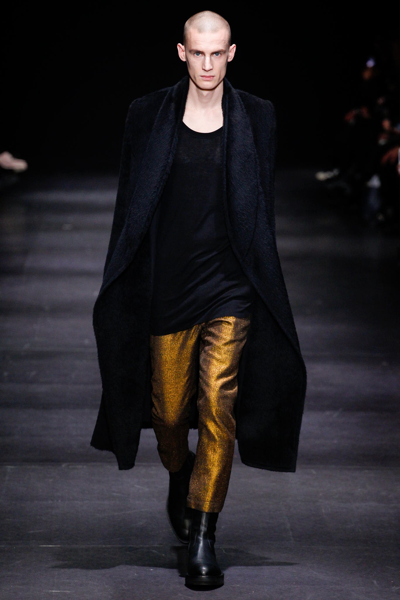 black wool coat with gold pants
