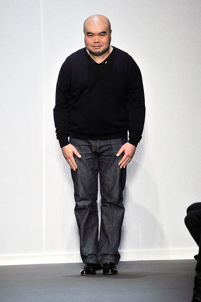 black relaxed sweater and blue jeans