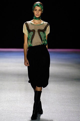beige embroidered silk top with black skirt