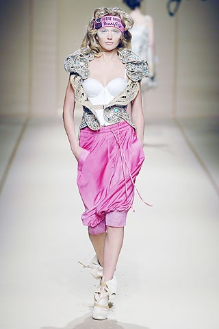 embroidered sleeveless jacket and pink pants