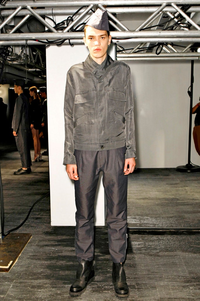 gray fitted jacket with black pants