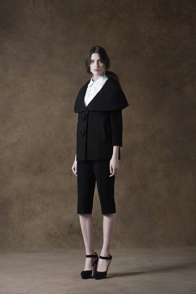 black wool cape with white blouse