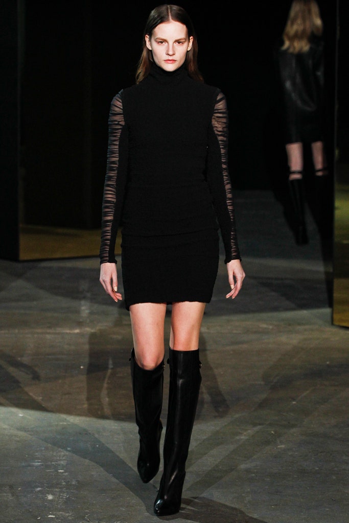 black fitted mini dress with knee-high boots