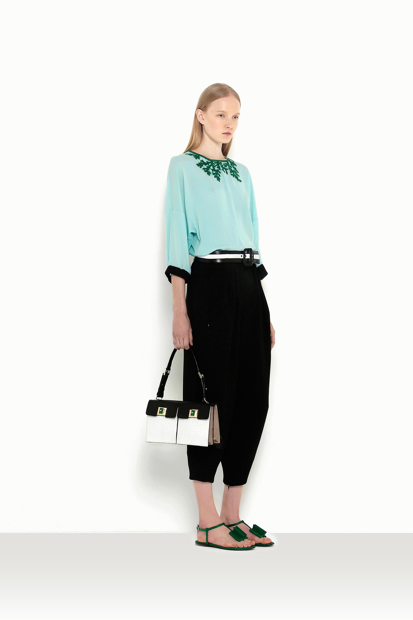 blue silk relaxed top with black pants