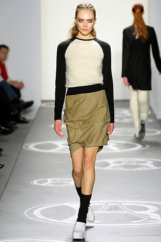 black and white color-blocked sweater with pleated skirt