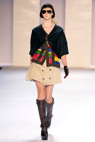 black multi-layered top with beige skirt