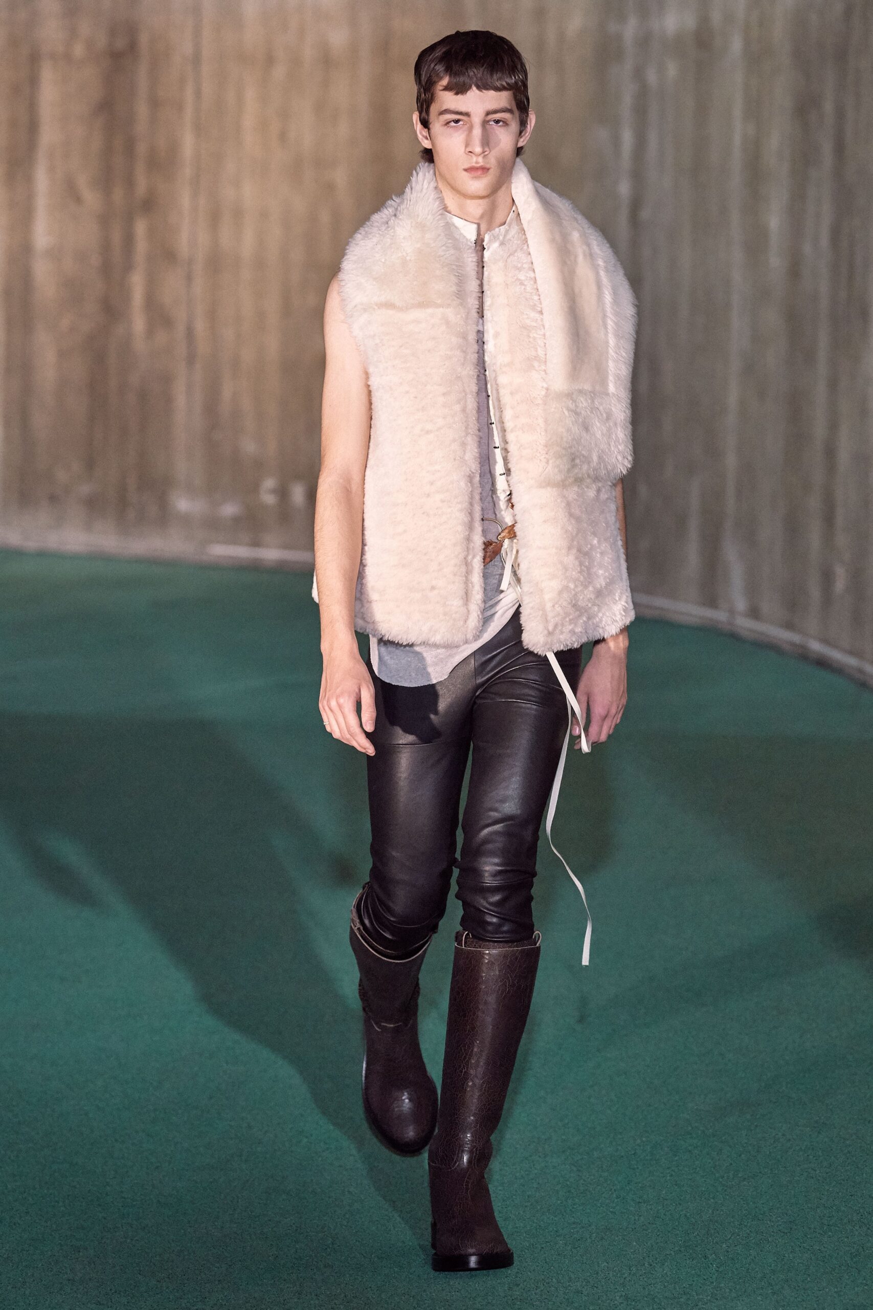 white faux-fur vest with black leather pants