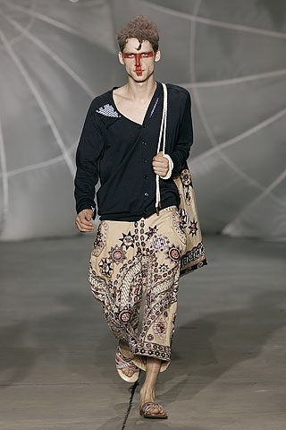 black relaxed shirt beige flared pants