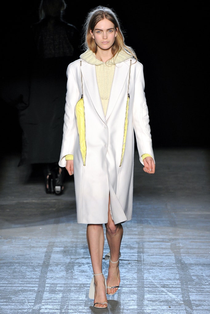 white fitted coat with yellow accents