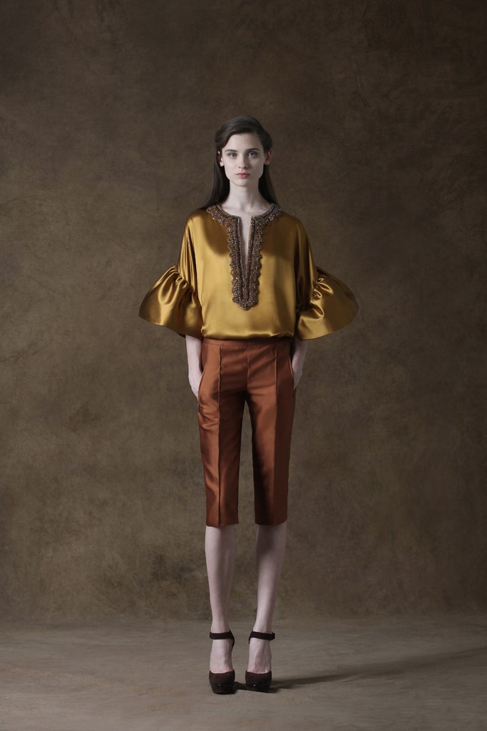 gold silk top with brown pants