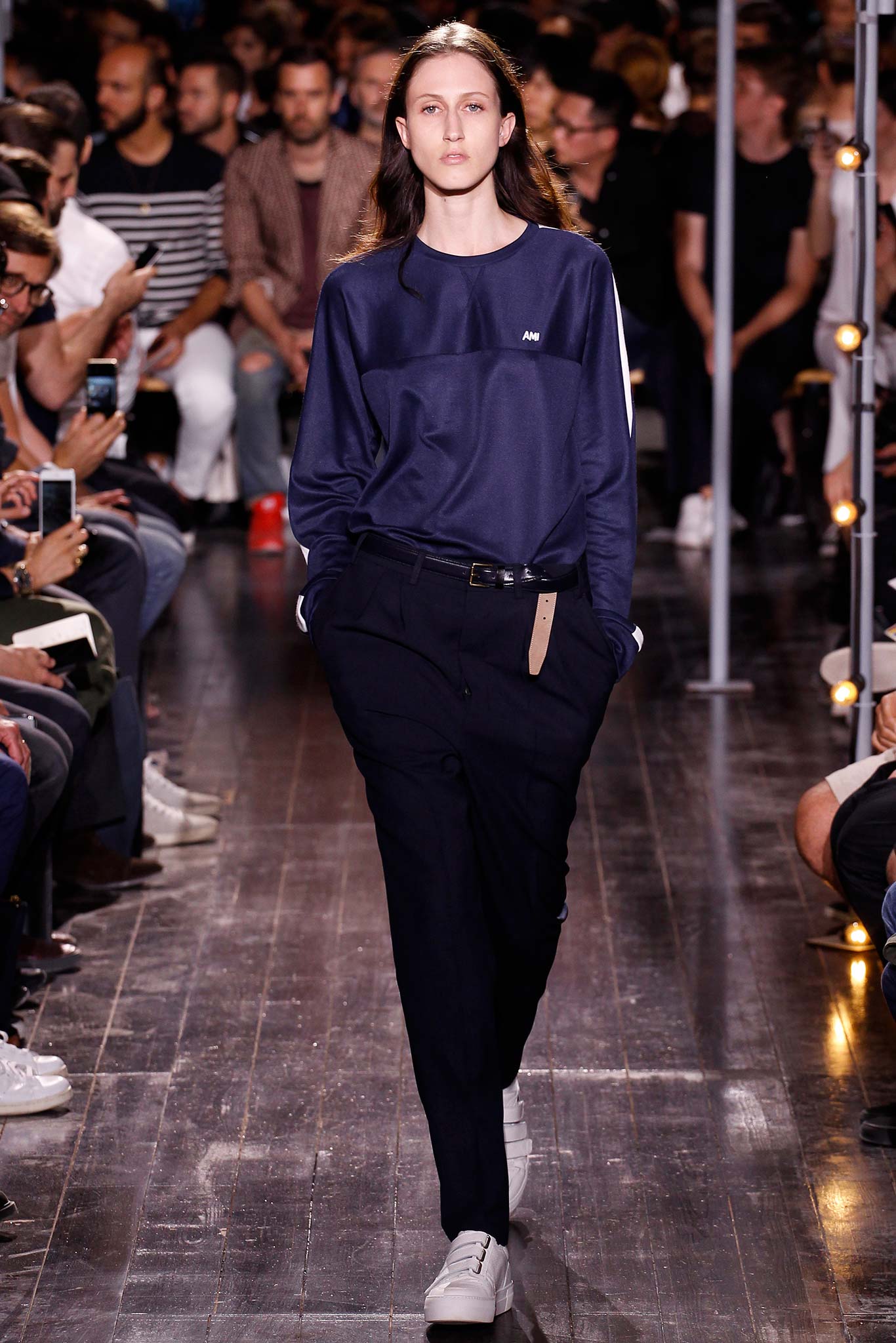 blue relaxed top with black tailored pants