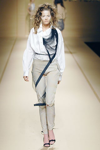 white relaxed shirt with beige pants