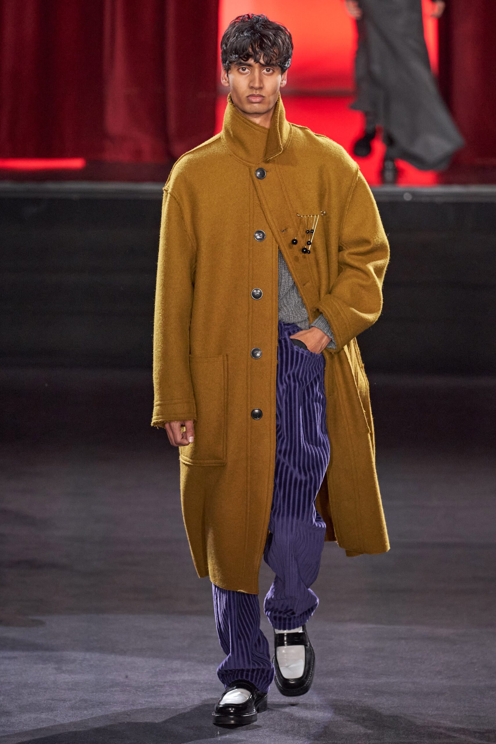 brown wool coat gray sweater blue striped pants