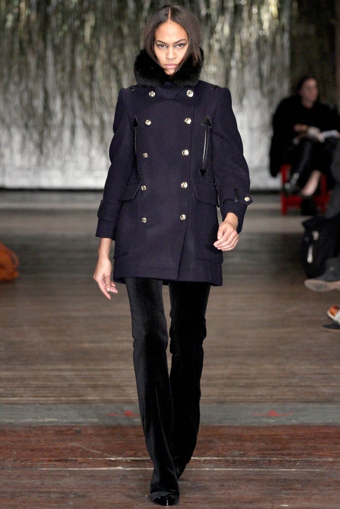 fitted black wool coat and slim pants