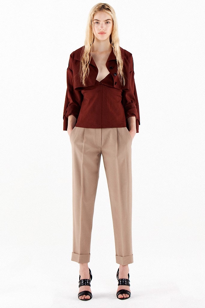 red fitted jacket with beige pants
