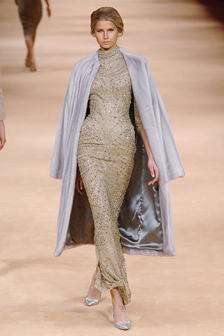 gold embellished gown with gray cape