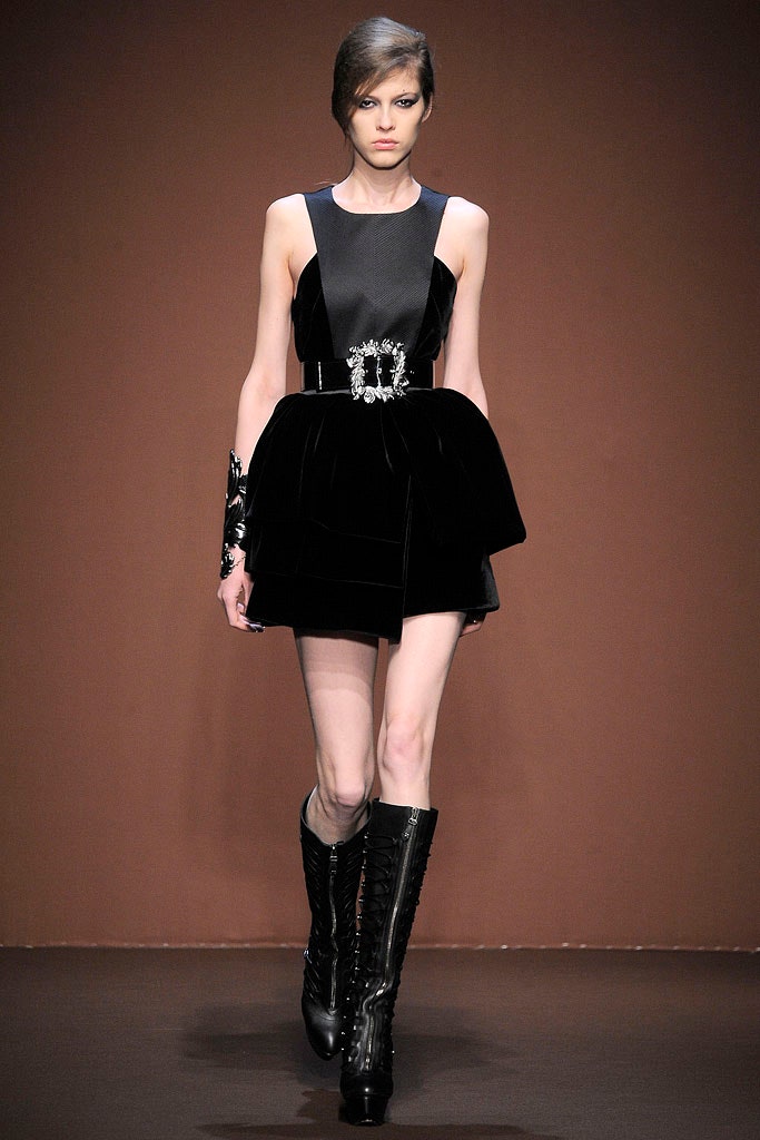 black velvet sleeveless high-neck fitted pleated belted dress