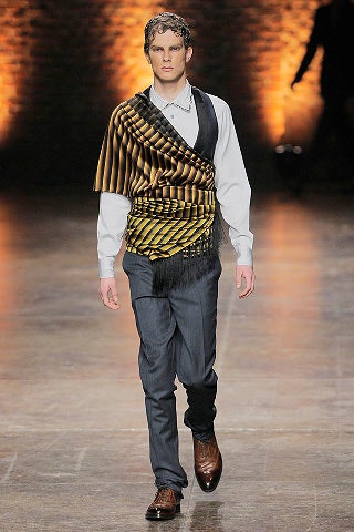 white shirt with gold poncho