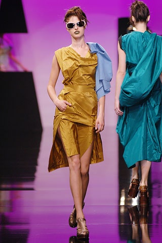 gold silk fitted dress with blue jacket