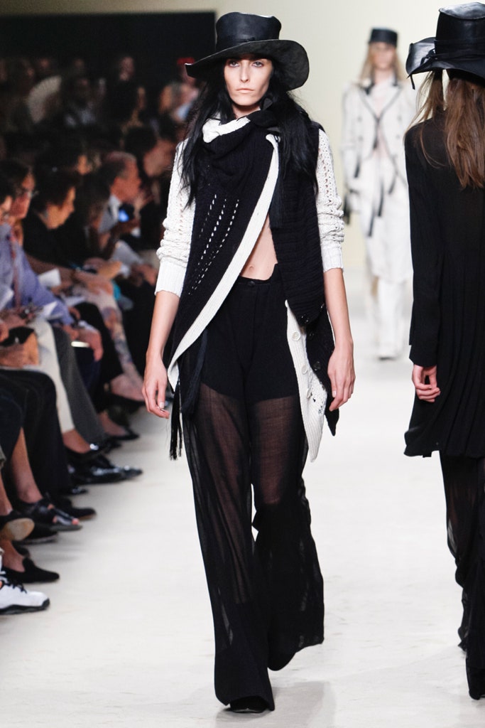 white relaxed top with black pants