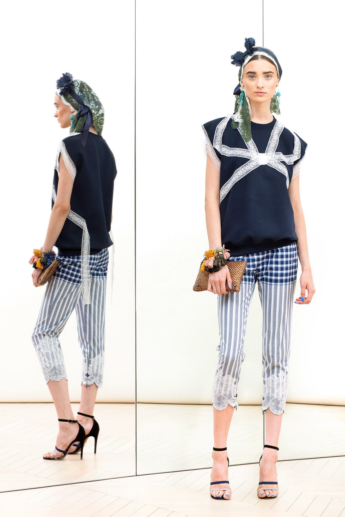 navy top with cropped striped pants