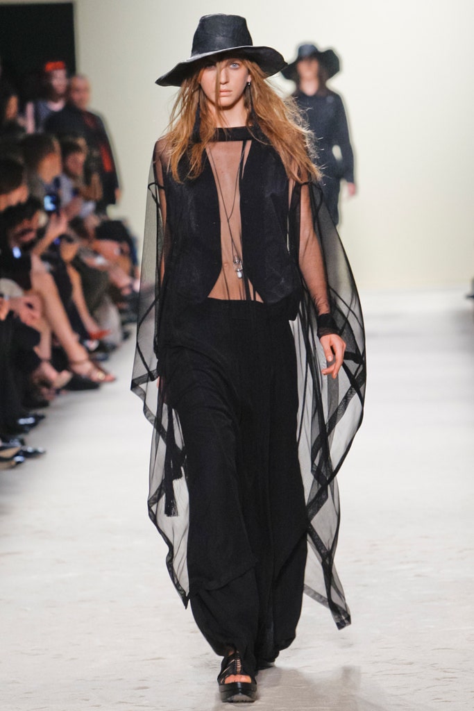 black flowing cape and fitted top