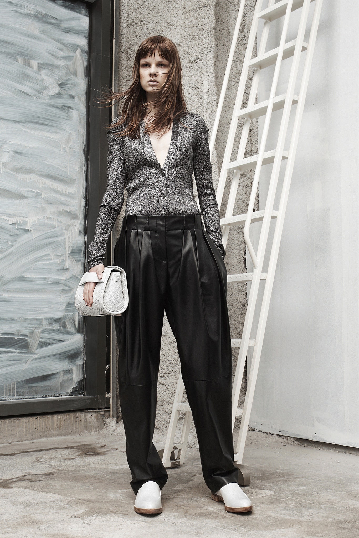 gray silk fitted shirt with black leather pants