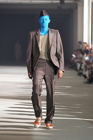gray tailored suit with olive t-shirt