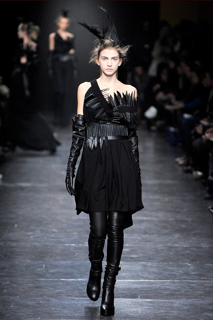 black fitted dress with gloves and boots