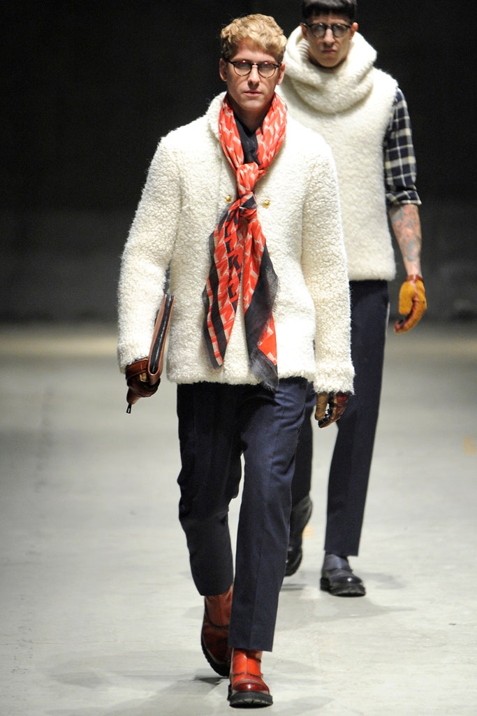 white wool coat with red scarf