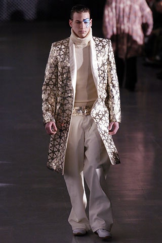 gold embroidered coat with white sweater