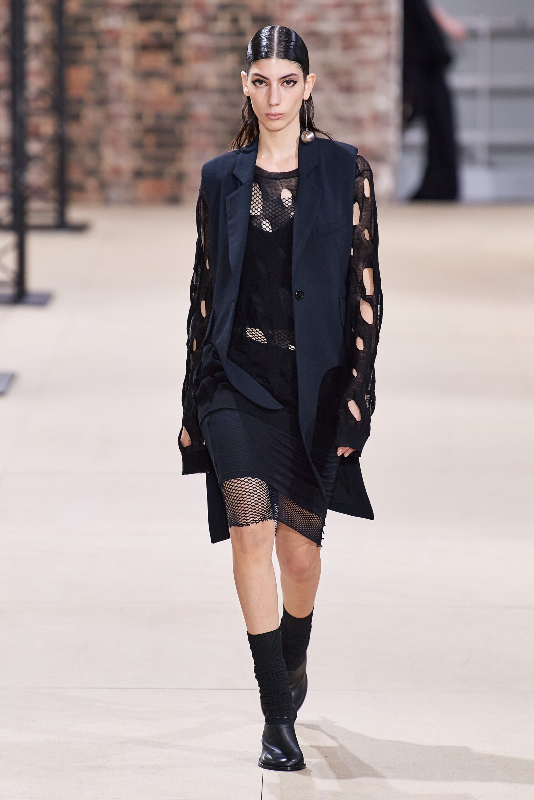 black fitted mini dress and relaxed jacket