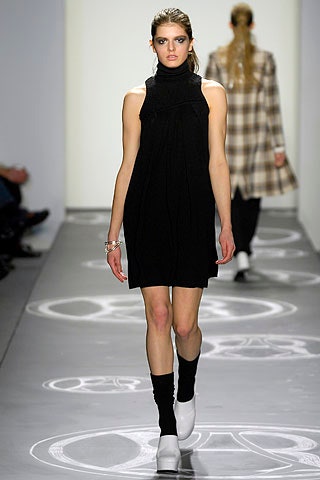 black fitted mini dress with white shoes