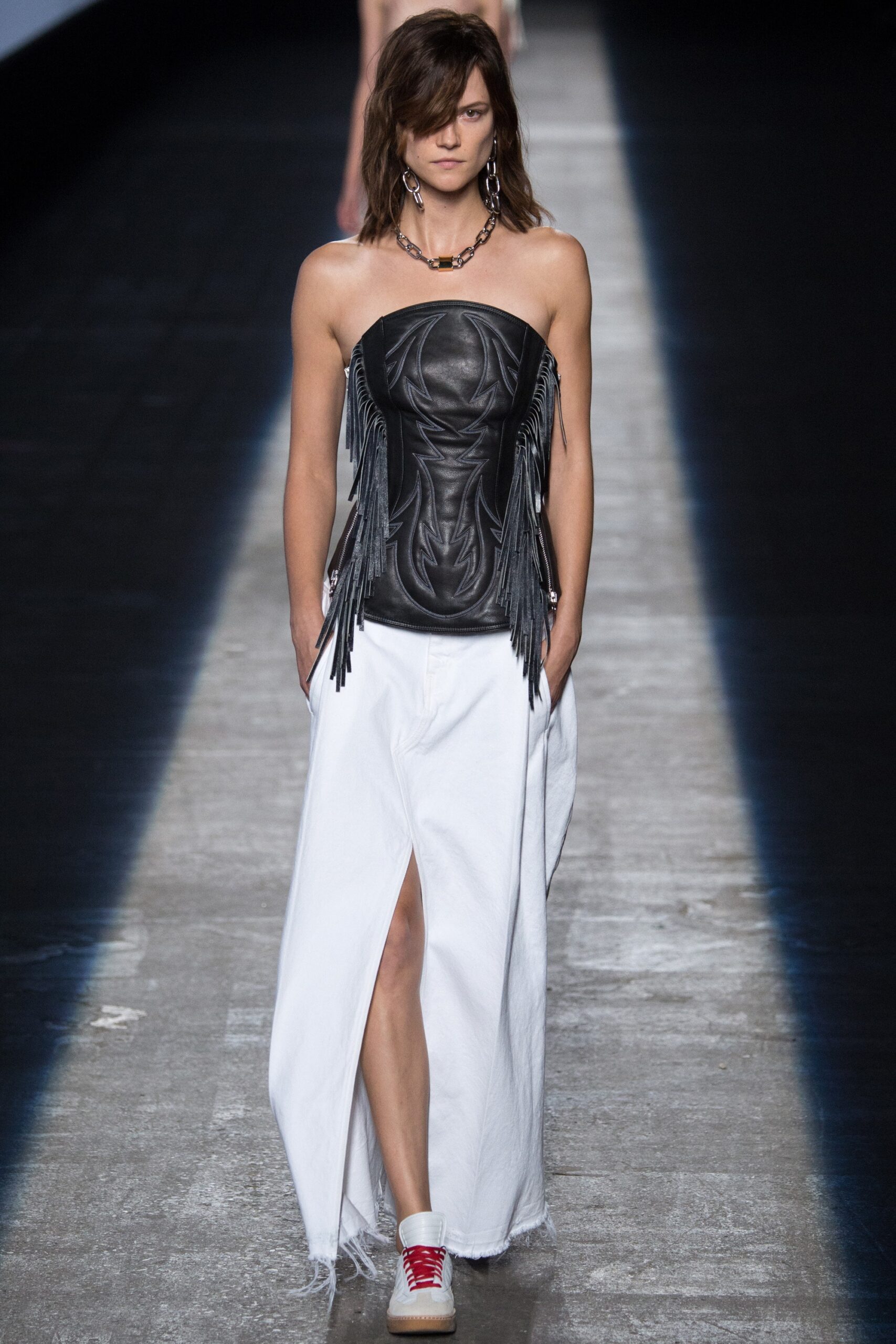 black leather bustier and white skirt