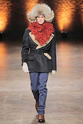 black tailored coat with red scarf