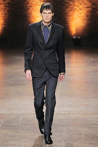 black tailored suit with blue shirt