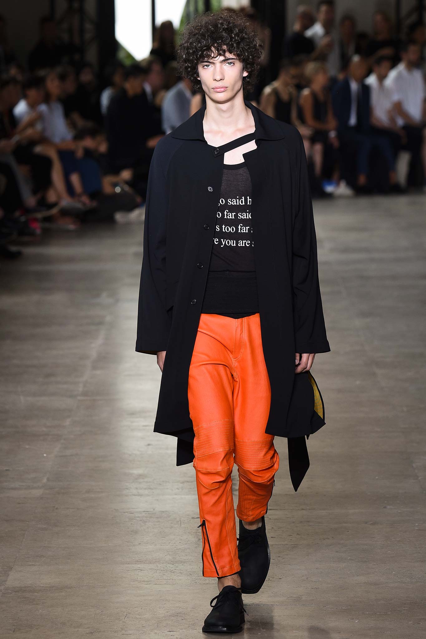 black coat with orange pants