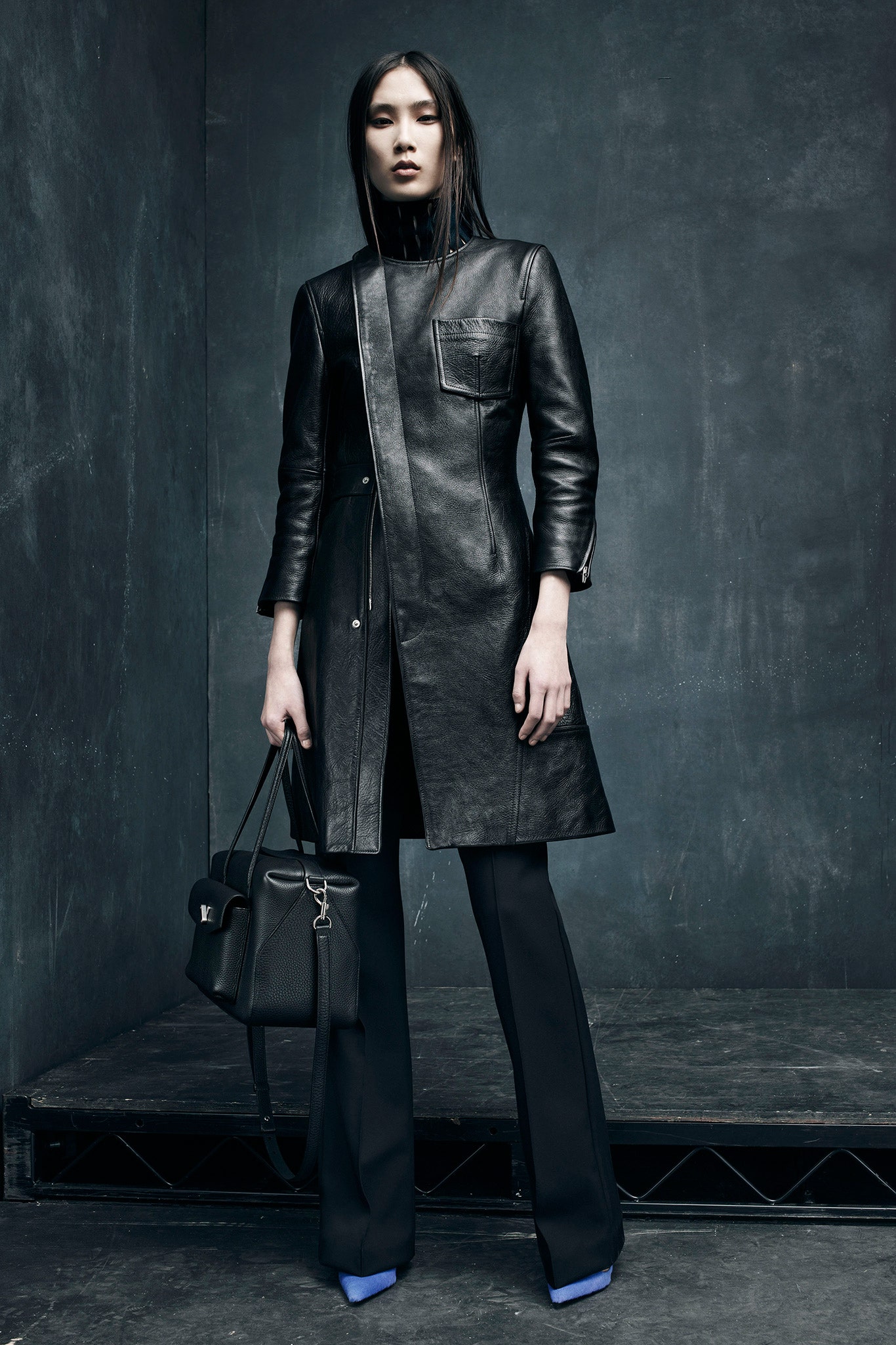 black leather coat and flared pants