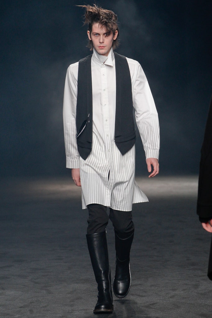 black vest over white shirt