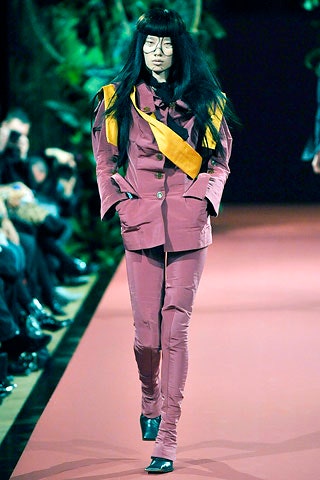 purple fitted suit with yellow bag