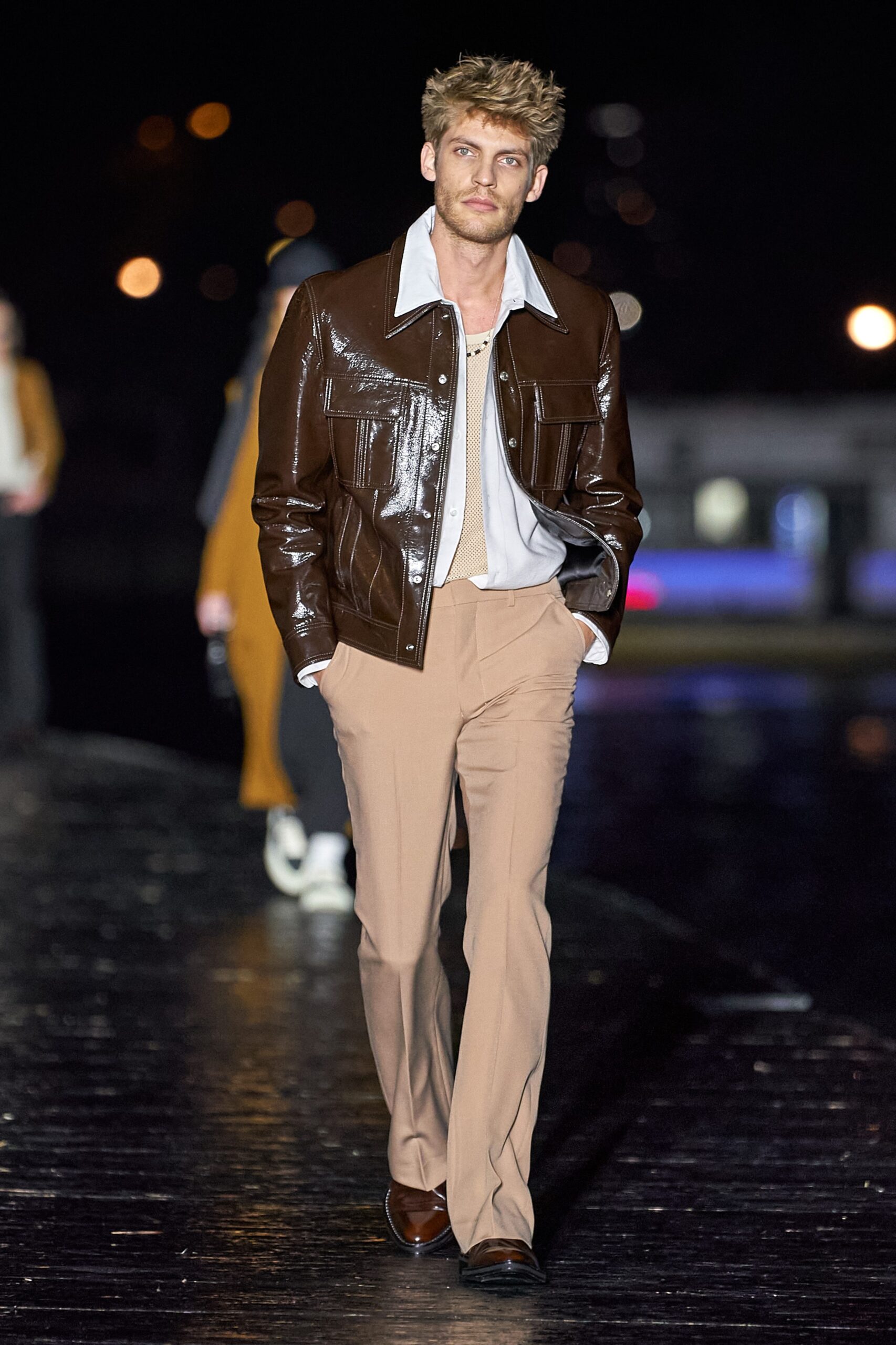 brown leather jacket with beige pants