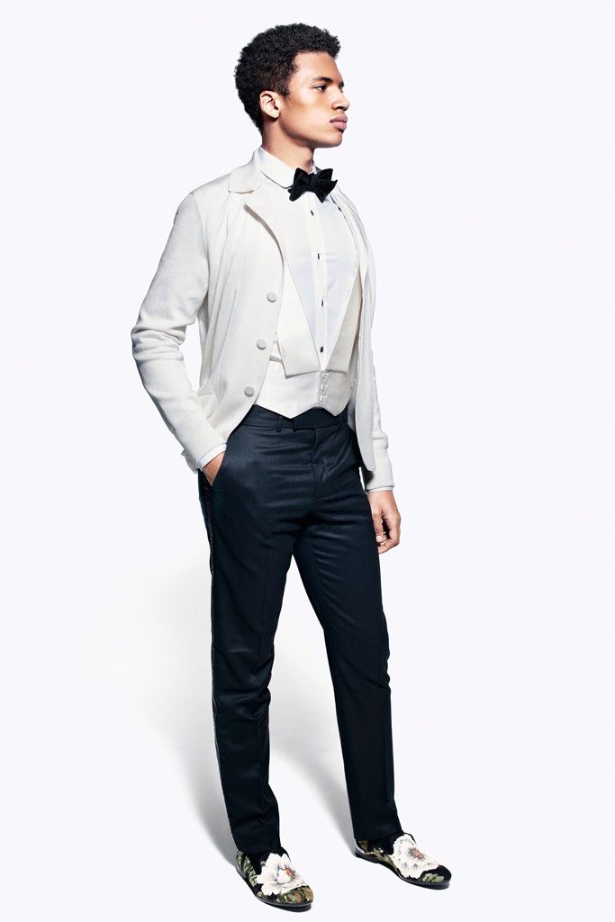 white blazer beige vest black pants