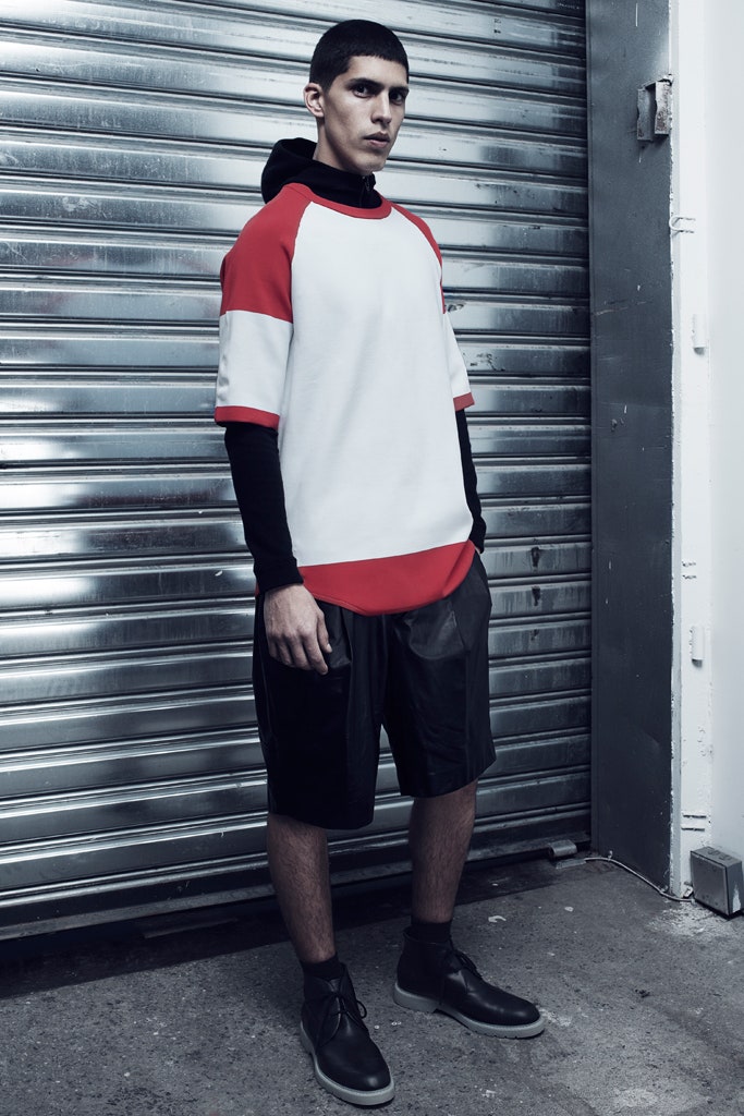 red and white relaxed t-shirt with black leather shorts