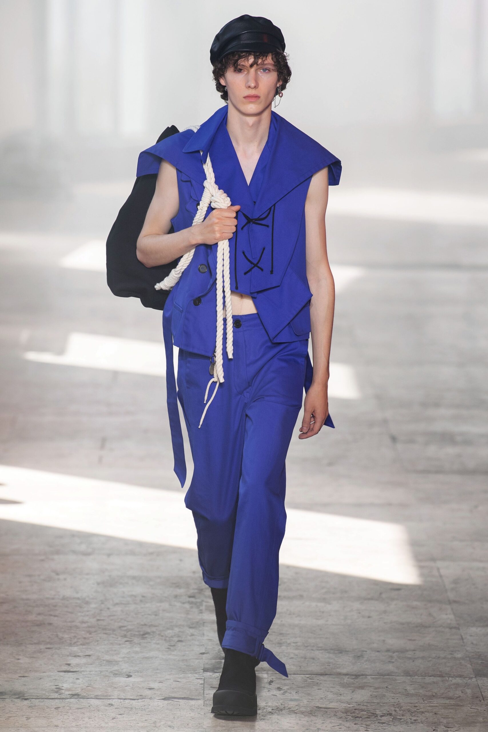 blue sleeveless collared fitted buttoned vest