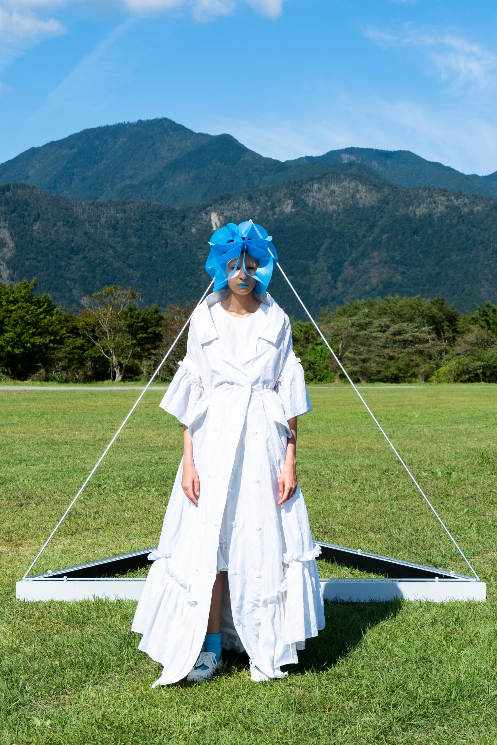 white relaxed tiered maxi dress with blue hat