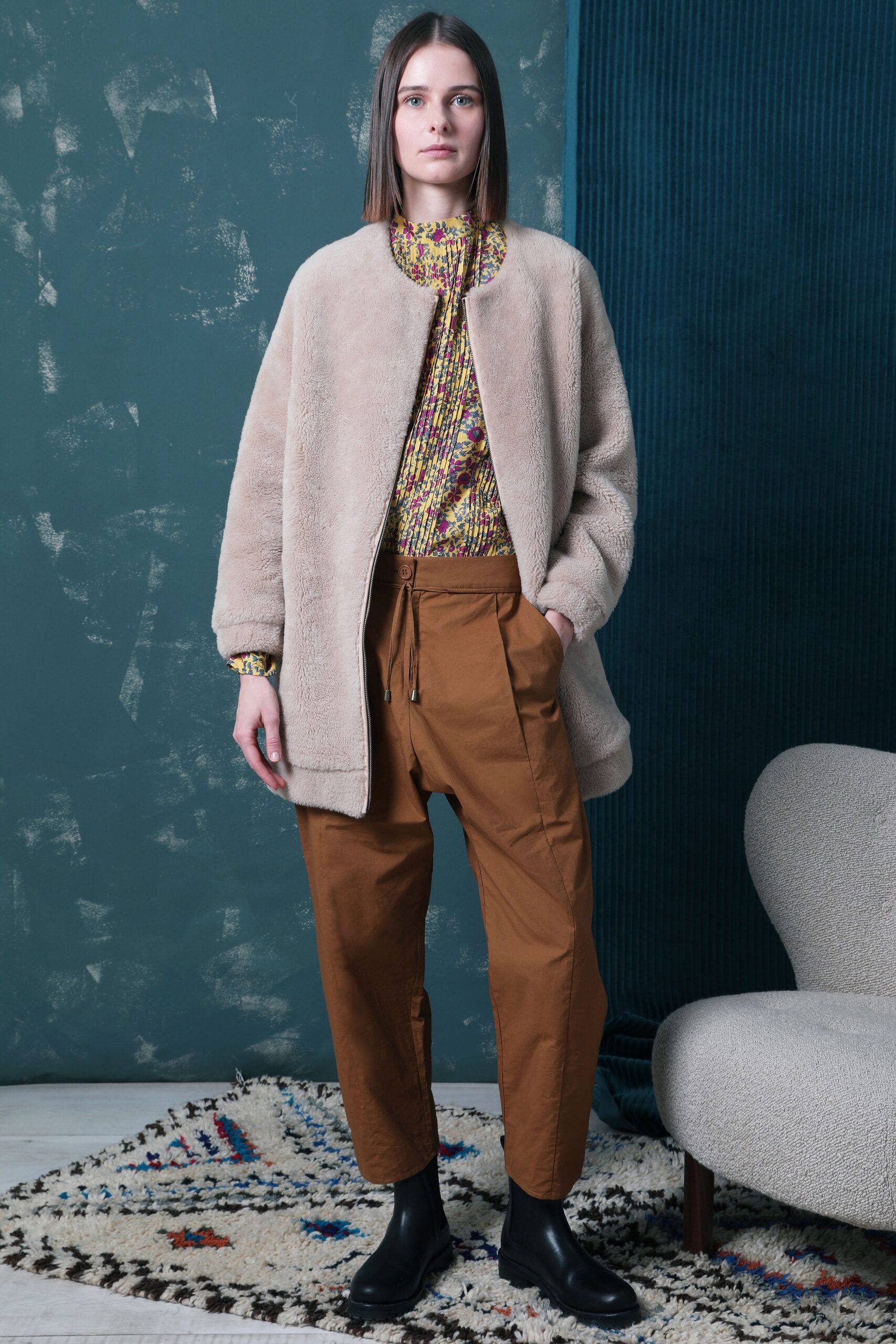 beige faux-fur coat with multi-colored top