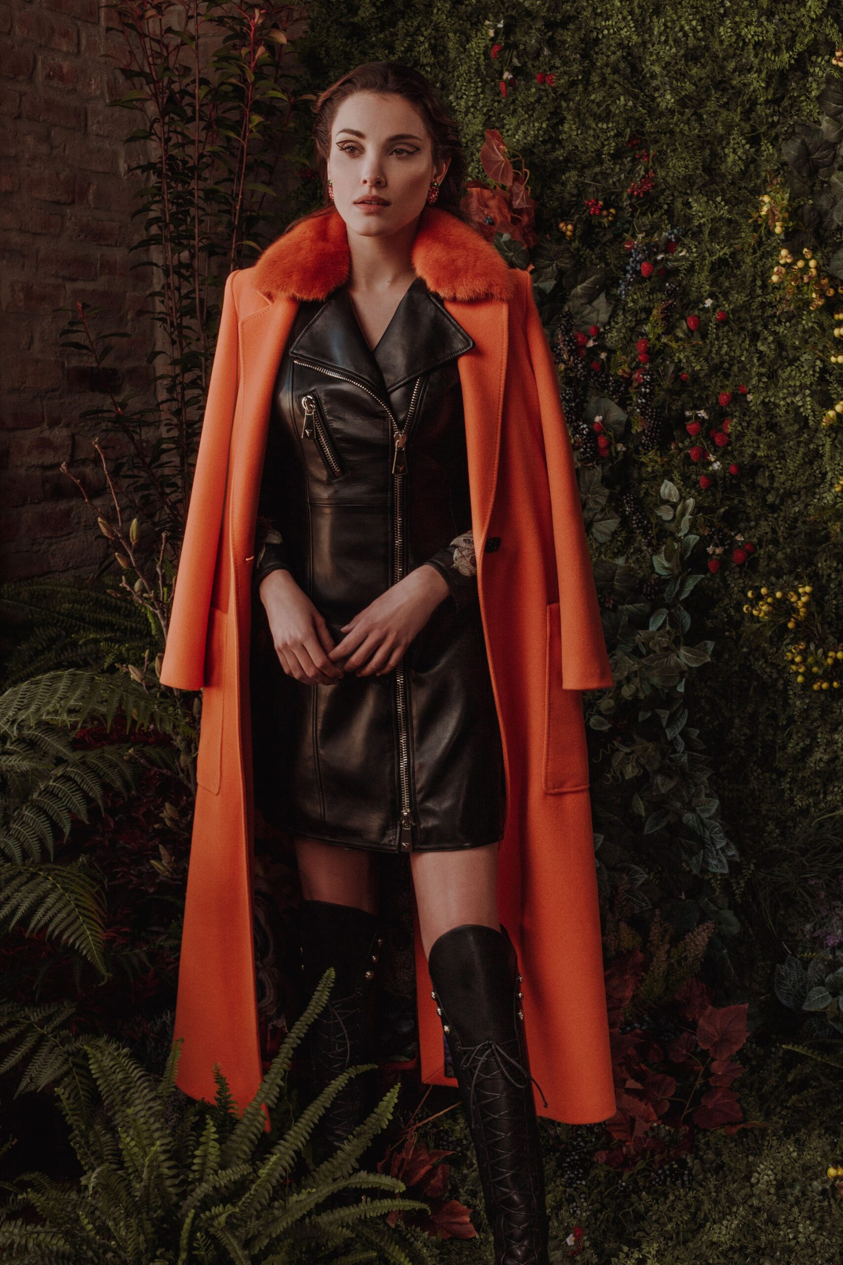 orange wool coat and black leather dress